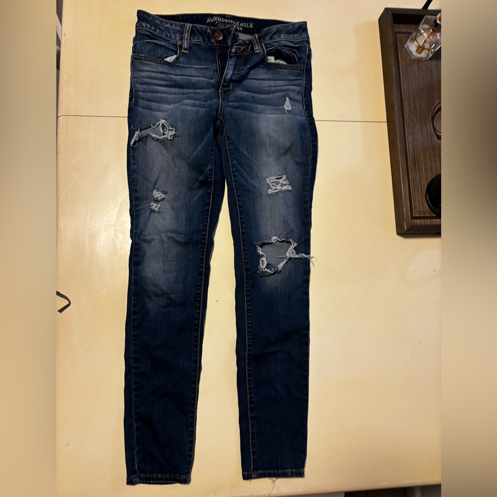 Distressed women’s Blue Jeans